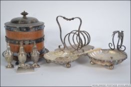 A stunning silver plate toast rack having a spiral rack adjoining a scalloped shaped preserve dish