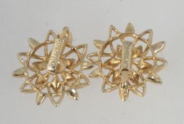 A pair of vintage gold tone Sarah Coventry clip on earrings in star flower form with clip fasteners.