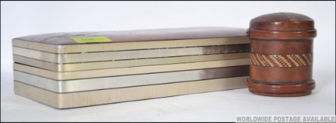 A stunning table top cigarette / cigar box having a leather hinged lid opening to reveal a fully