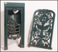 A decorative Victorian cast iron bedroom fireplace of smaller proportions along with a cast metal