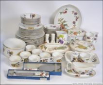 An extensive collection of Worcester Evesham dinner service to include tureens, plates, cruets,