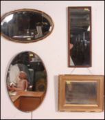 A collection of four vintage and antique mirrors to include a gilt framed mirror,