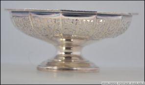 A silver hallmarked fret pierced bon bon dish raised on a circular pedestal foot having assay stamp