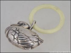 A silver continental marked stamped 925 Victorian style teething ring and rattle in the form of a