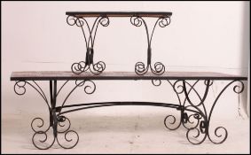 A retro wrought iron and tile top coffee table together with a matching side table.