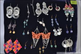 A collection of 20 pairs of assorted costume jewellery earrings to include ceramic, glass,