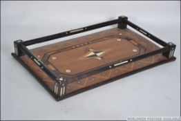 A wooden geometric tray with inlaid parquetry , art deco from the 30's. Measures: 52cms x 30cms.