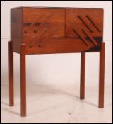 A vintage retro concertina work / sewing box having six sectional pull out compartments raised on