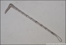 A sterling silver ladies brooch in the form of a riding crop - hunting interest.