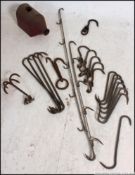 A large collection of vintage early 20th century butchers meat - game hooks.