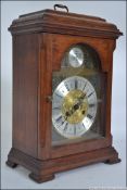 A 20th Century Georgian style Bracket Clock inscribed Tempus Fugit,