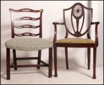 A Georgian 19th century leather and mahogany hepplewhite desk chair with shaped backrest and elbow