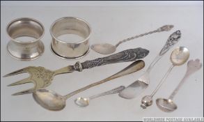 A collection of silver hallmarked items to include napkin rings x 2 both Birmingham, weight 27.3g.