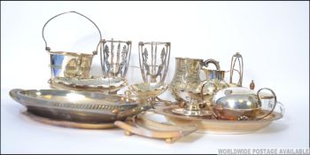 A collection of silver plate items to include dishes, Ice bucket,