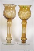 A pair of 20th century cut glass Bohemian tall bowl vases in yellow with etched decoration.
