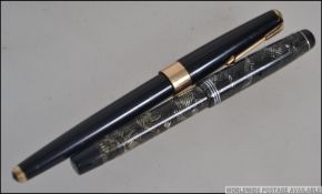 Two vintage 20th century Parker fountain pens both Parkers having gold metal nibs