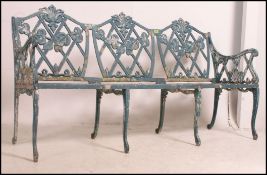 A stunning Coalbrookdale style green painted rustic pattern cast iron garden bench beautifully
