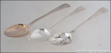 A 19th century Georgian Irish desert spoon by Michael Keating together with 2 other Georgian silver