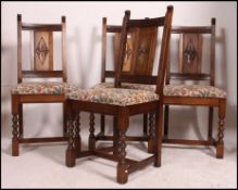 A set of 4 Old Charm oak dining chairs of good quality being raised on bobbin turned supports with