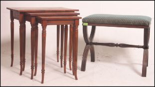 A good quality antique style walnut nest of tables,