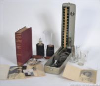 A collection of vintage medical items to include vials / measures , nurses photographs,