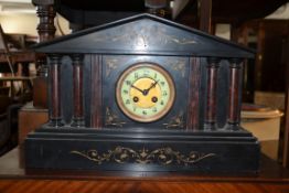 Victorian black slate and marble mantle clock of classical form with twin column supports and