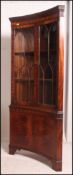 A good quality Georgian revival inverted bow front corner cabinet having astragal glazed display