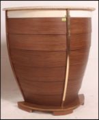 A vintage retro 20th century boat bar with rope embellished edges having shelved rear.