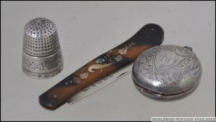 A silver hallmarked mother of pearl inlaid tortoiseshell pen knife by Alfred Taylor,