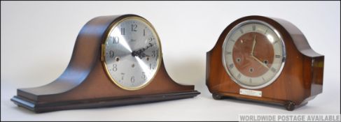 Two 20th century oak cased mantle clocks one with an engraved plaque with notation for British Rail.