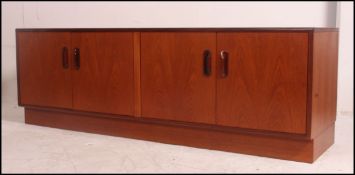 A vintage mid century G-Plan long and low sideboard in the Fresco design comprising 2 double