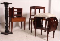 An ebonised torchere plant stand together with an oak coaching / luggage stand,