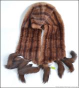 A 1950's vintage ladies fur stole with tail ends, the inner being lined.