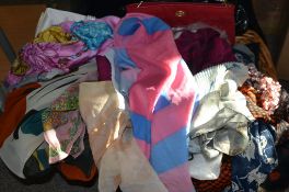 A collection of silk and other ladies scarves along with hair slides,
