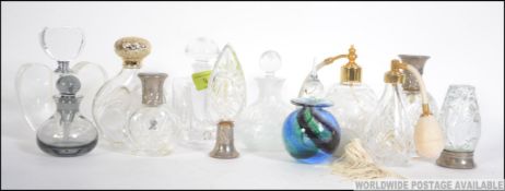 A collection of vintage and later glass perfume bottles to include cut glass, Royal Doulton,