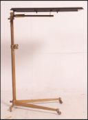 A vintage mid century Peter Pan bakelite and painted metal lectern reading stand raised on a frog
