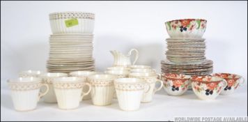 A Victorian chintz pattern part tea service together with another part tea service comprising cups,