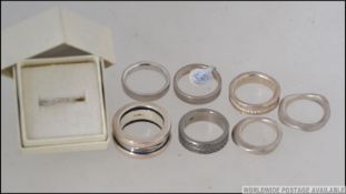 A collection of silver band rings marked 925 to the inner shanks.