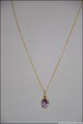 A 9ct gold and amethyst pendant being Birmingham hallmarked and of lozenge form. Weight 2.7g.