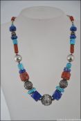 A Chinese / Tibetan silver, turquoise and agate stone set necklace.