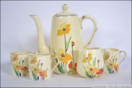 A Crown Staffordshire part coffee tea service comprising cups, saucers,