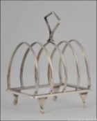A silver hallmarked toast rack of small form by Robert Pringle & Sons, London 1943. Total weight 52.