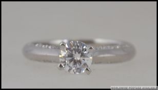 A silver 925 white metal and CZ engagement ring