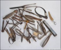 A collection of nutcrackers dating to the 19th & 20th century together with calipers and cast metal