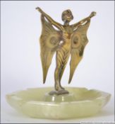 An early 20th century cast bronze figure of a lady - nymph in a flapper dress with butterfly wings