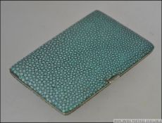 A mid century vintage shagrin and white metal cigarette case of rectangular form.