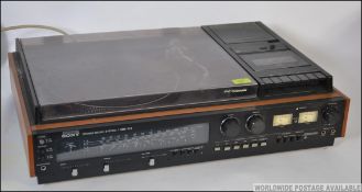 A good retro 1970's Sony Fully Automatic hi-fi unit having a smoked acryllic top with radio,