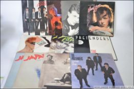A collection of vinyl long play and 12