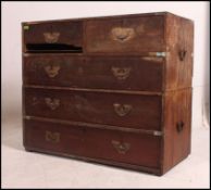A 19th century anglo - Indian teak wood campaign chest having recessed handles to the drawers and