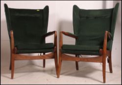 A pair of good Danish influenced teak wood Parker Knoll type armchairs raised on angular frames